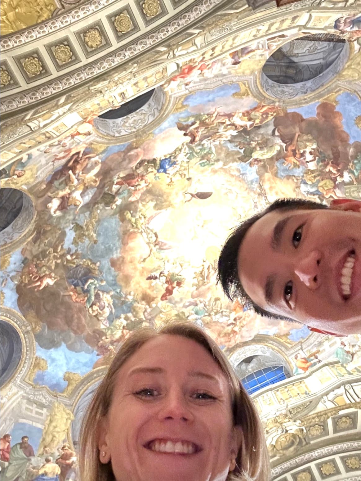 Katie and Fitz traveling in Europe, seen from below